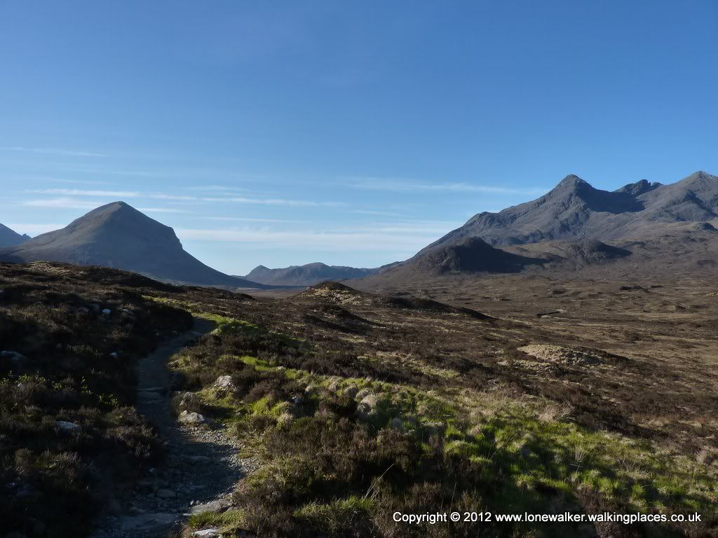 It's a beautiful warm, early morning, heading into the glen with Marsco to the left and the Cuillins to the right