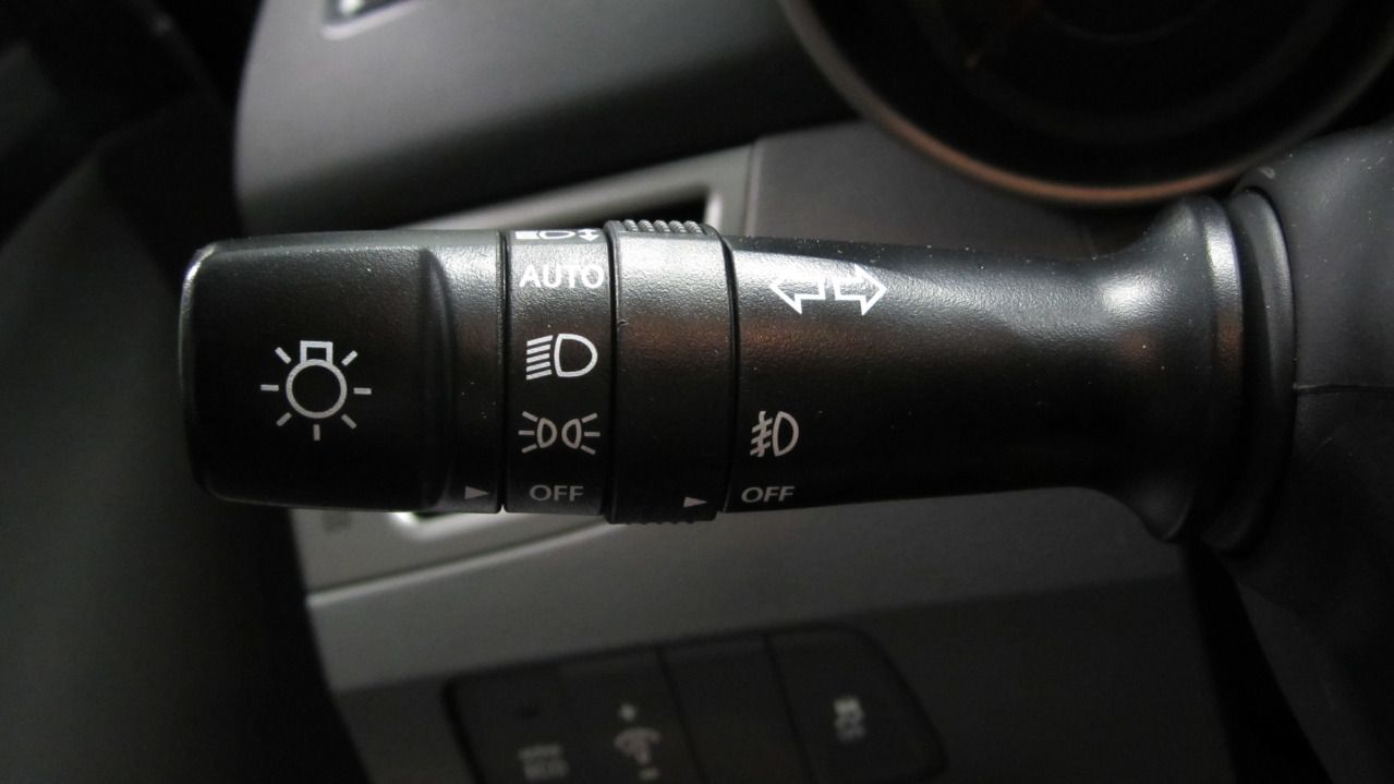 How does an automatic headlight sensor work?